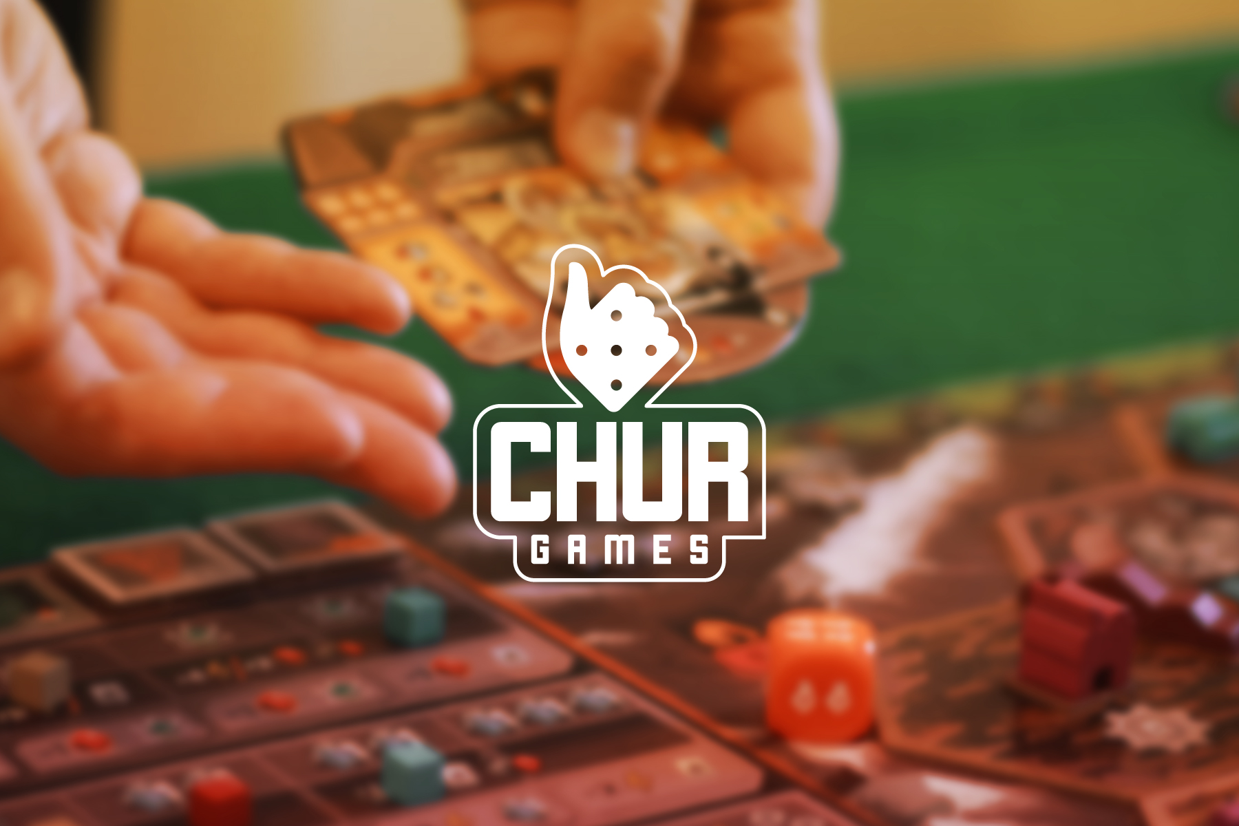 Logo Chur Games sovrapposto alla foto di una partita a un gioco da tavolo